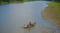 Fishermen are travelling on a boat in the river unique photo