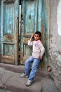 Poor boy at doorstep Royalty Free Stock Photo