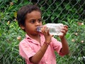 Poor Boy Drinking Water