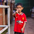 Poor Cambodian boy shows victory sign