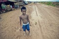 Poor cambodian kid playing Royalty Free Stock Photo