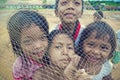 Poor cambodian kids playing with trawl Royalty Free Stock Photo