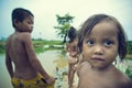 Poor cambodian kids on Tonle Sap lake Royalty Free Stock Photo