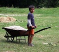 Poor children working on a field