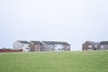 Poor council houses on cliff horizon in seaside town by coast