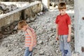 Poor and dirty street children living on an abandoned constructi