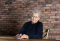 Poor elderly woman counting coins Royalty Free Stock Photo