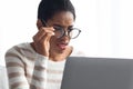 Poor Eyesight Concept. African American Lady In Eyeglasses Looking At Laptop Screen Royalty Free Stock Photo