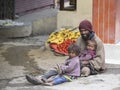 Poor family of beggars on the streets in India Royalty Free Stock Photo