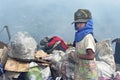 Poor Filipino boy gathering plastic, paper on landfill