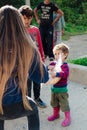 Poor gypsy kids getting bread from volunteers Royalty Free Stock Photo