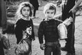 Poor gypsy kids getting bread from volunteers Royalty Free Stock Photo