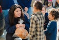 Poor gypsy kids getting bread from volunteers Royalty Free Stock Photo