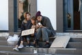 Poor homeless family begging and asking for help Royalty Free Stock Photo