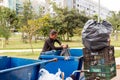 A Poor Homeless Indigenous Woman Picking through the Trash