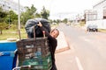 A Poor Homeless Indigenous Woman Picking through the Trash