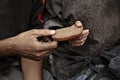 Poor homeless people sharing piece of bread, closeup Royalty Free Stock Photo