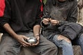 Poor homeless people sharing piece of bread Royalty Free Stock Photo