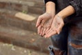 Poor homeless woman begging for help outdoors Royalty Free Stock Photo