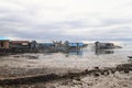 Poor houses above sea Royalty Free Stock Photo