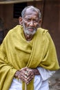 A poor indigenous old man of India looks at the camera with astonished eyes