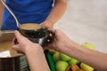 Poor little child receiving food from volunteer in charity centre Royalty Free Stock Photo