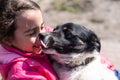 poor little girl with a dog in village Royalty Free Stock Photo