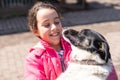 poor little girl with a dog in village Royalty Free Stock Photo