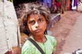 Poor little girl near road