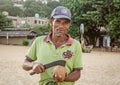 A poor local man sells coconut