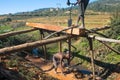 Poor malagasy men cutting timber