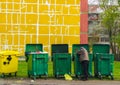 Poor man looking for food in a waste container Royalty Free Stock Photo