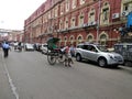 Poor Man pulling rickshaw on street of Indian metro city Kolkata