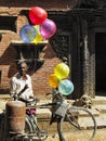 Poor man selling balloons