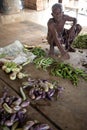 Poor man selling vegetables