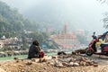 poor man sits on the banks of the Ganges river