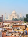 Poor neighborhoods and luxurious Taj Mahal. Agra, India Royalty Free Stock Photo