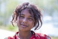 Poor nepalese girl on the street in a Himalayan village, Nepal