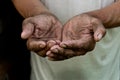 The poor old man& x27;s hands beg you for help. The concept of hunger Royalty Free Stock Photo