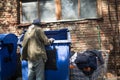 Poor old tramp in search for food or empty bottles. Royalty Free Stock Photo