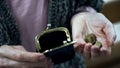 Poor old woman counting last money from wallet, lack of budget, small pension Royalty Free Stock Photo