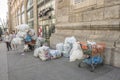 Poor people collect cans and plastic bottles and sell them back to shops. They earn money by getting a small deposit on the cans