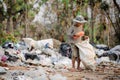 Poor people collect garbage for sale, People living in garbage heaps walking to collect recyclable waste to be sold to poverty