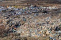 Poor people collecting garbage at city garbage dump. Pile of plastic trash, food waste on landfill. Concept of poverty and Royalty Free Stock Photo