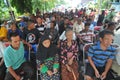 Poor people queued cash assistance from the government