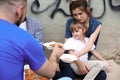 Poor people receiving food from volunteer