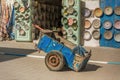 A man sleeping in a backboard wagon