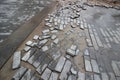 Poor quality paving stones, road blurred, road repair close up