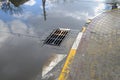 Poor repair of roads. After the rain, the water does not drain into the sewer Royalty Free Stock Photo