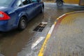 Poor repair of roads. After the rain, the water does not drain into the sewer. Royalty Free Stock Photo